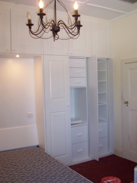 HINGED ROBE WITH TILT-AWAY BED